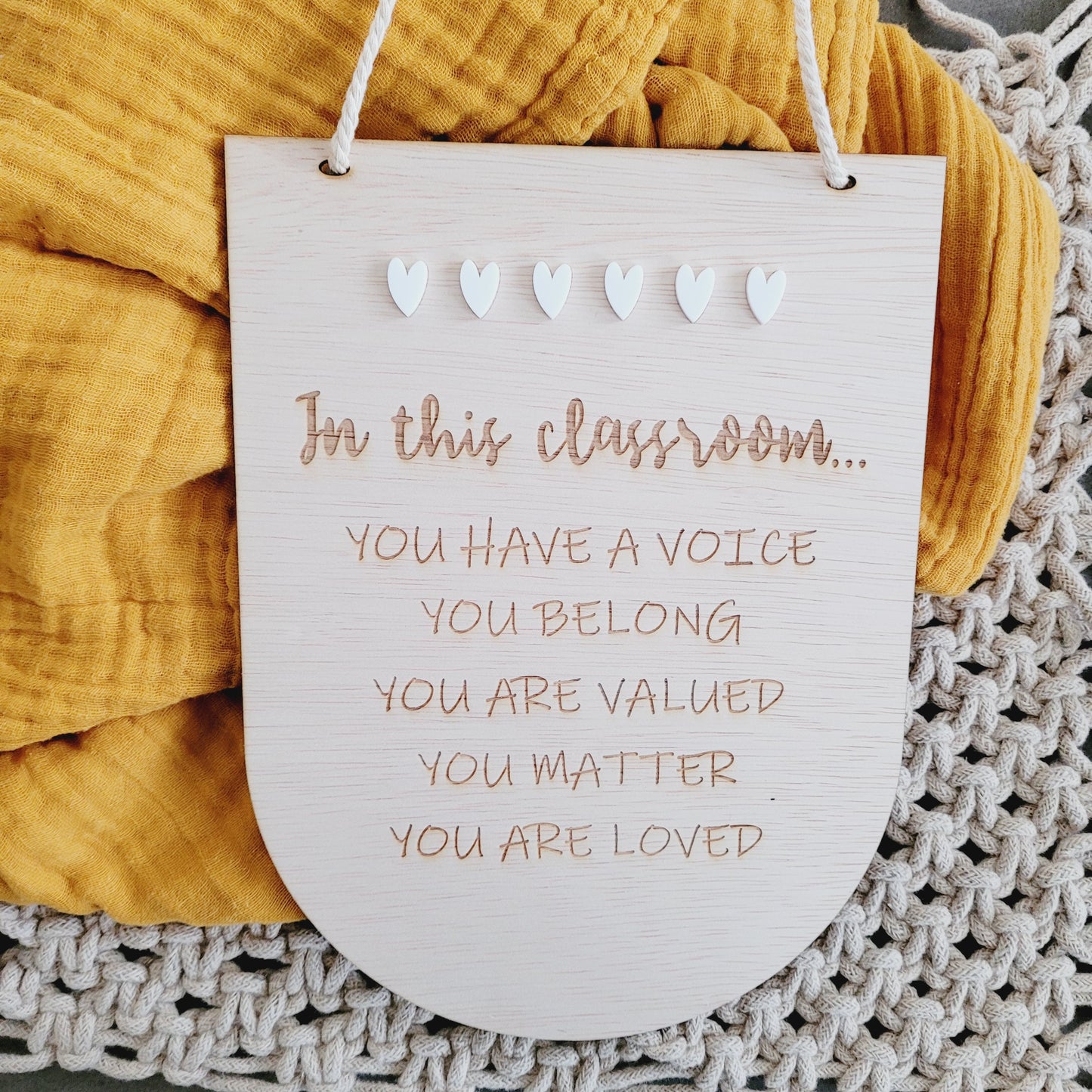 In this classroom plaque